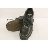 Pair of Doc Marten black leather size 10 shoes.