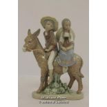 Lladro figure of a boy and girl seated on a donkey, 19cm.