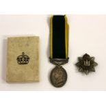 Devonshire Regimental badge and Territorial Efficiency medal.