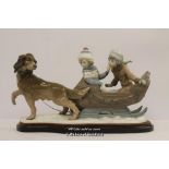 Lladro figure group Sleigh Ride 5037, with velvet covered hardwood stand.