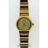 Ladies' Pulsar gold coloured stainless steel wristwatch, circular gold coloured dial with white