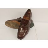 Pair of Bakers of Earls Barton brown leather slip-on shoes, size 8.5.