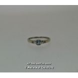 Aquamarine and diamond ring, round cut aquamarine rubover set to the centre, with a round