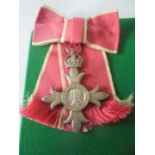 Member of the Order of the British Empire, King and Queen obverse, civilian, on ladies bow ribbon.
