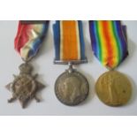 A Mons Star and Bar Trio to Private W.H. Moore, 1st Battalion, Devonshire Regiment. 1914 Star,