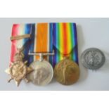 A Mons Star and Slide on Bar with Silver War Badge to Private W. Albones, Coldstream Guards. 1914