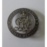 Silver War Badge. No.54967 awarded to Private James W. Lowry, Royal Fusiliers, discharged due to