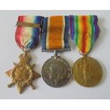 A Mons Star and Bar Trio to Private W. Battrick, 1st Battalion, Norfolk Regiment. 1914 Star, bar 5th