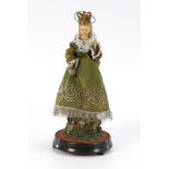 Wachsfigur Maria Bambina als Himmelskönigin.Wohl Ende 19. Jh. Wachs, Draht, Holz und Stoff,