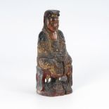Guanyin aus Holz.Wohl China, Anfang 19. Jahrhundert. Holz farbig gefaßt, H 27 cm. Aus einem Stück