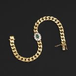 Massives Armband mit Smaragd und Diamanten.585 GG/WG, 18,5 x 0,6 cm, 24,1 g. Blütenglied mit