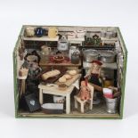 Kleine Puppenküche.Wohl um 1930-50. Tapeziertes Holzgehäuse. 20,5 x 31,5 x 24 cm. Schlichtes 1-