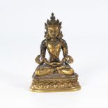 Kleiner Buddha.Wohl Tibet, Messing feuervergoldet. H 13,5 cm. Auf doppeltem Lotosthron sitzende