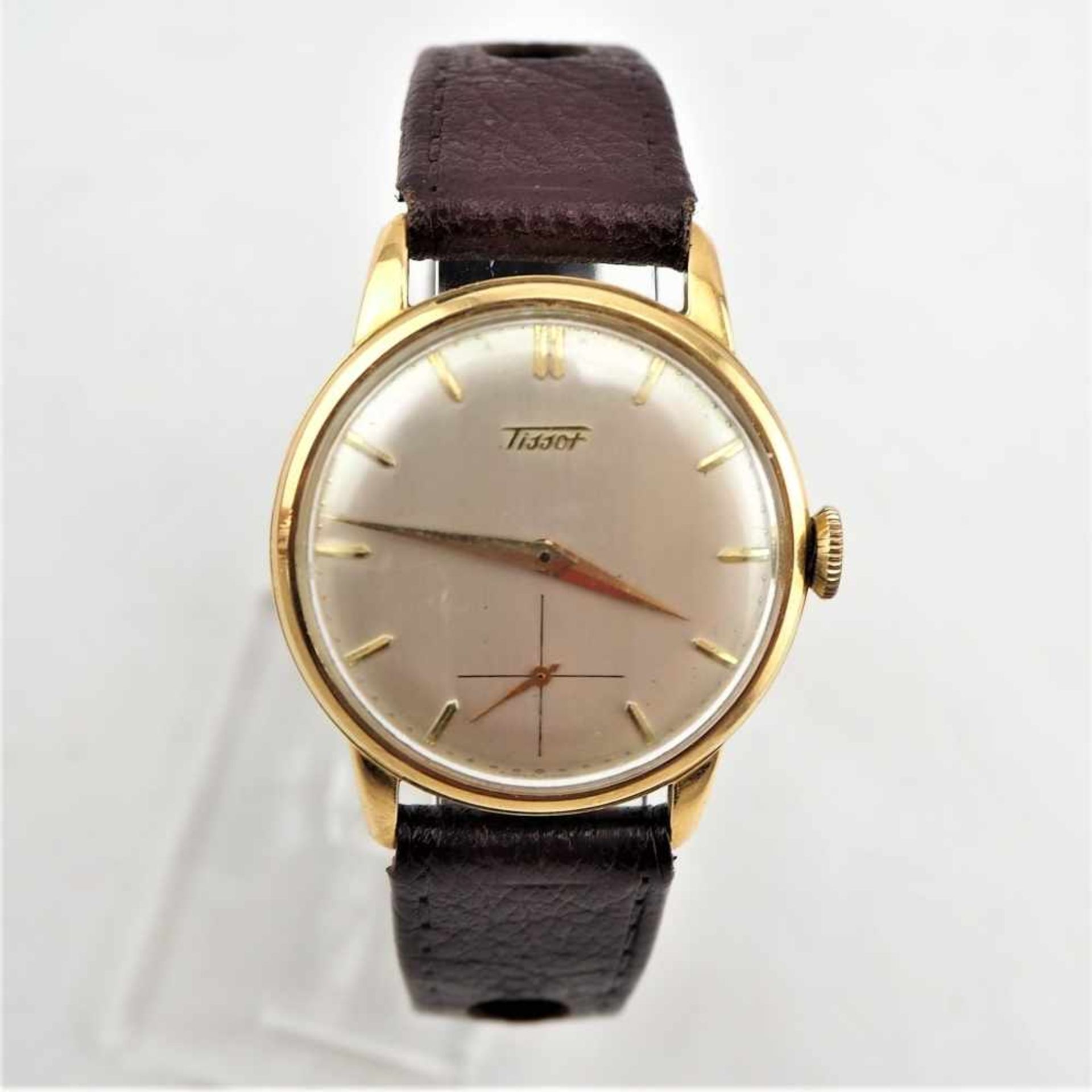 Tissot Herrenarmbanduhr, 1954Herrenarmbanduhr im Goldgehäuse. Zifferblatt cremefarben mit