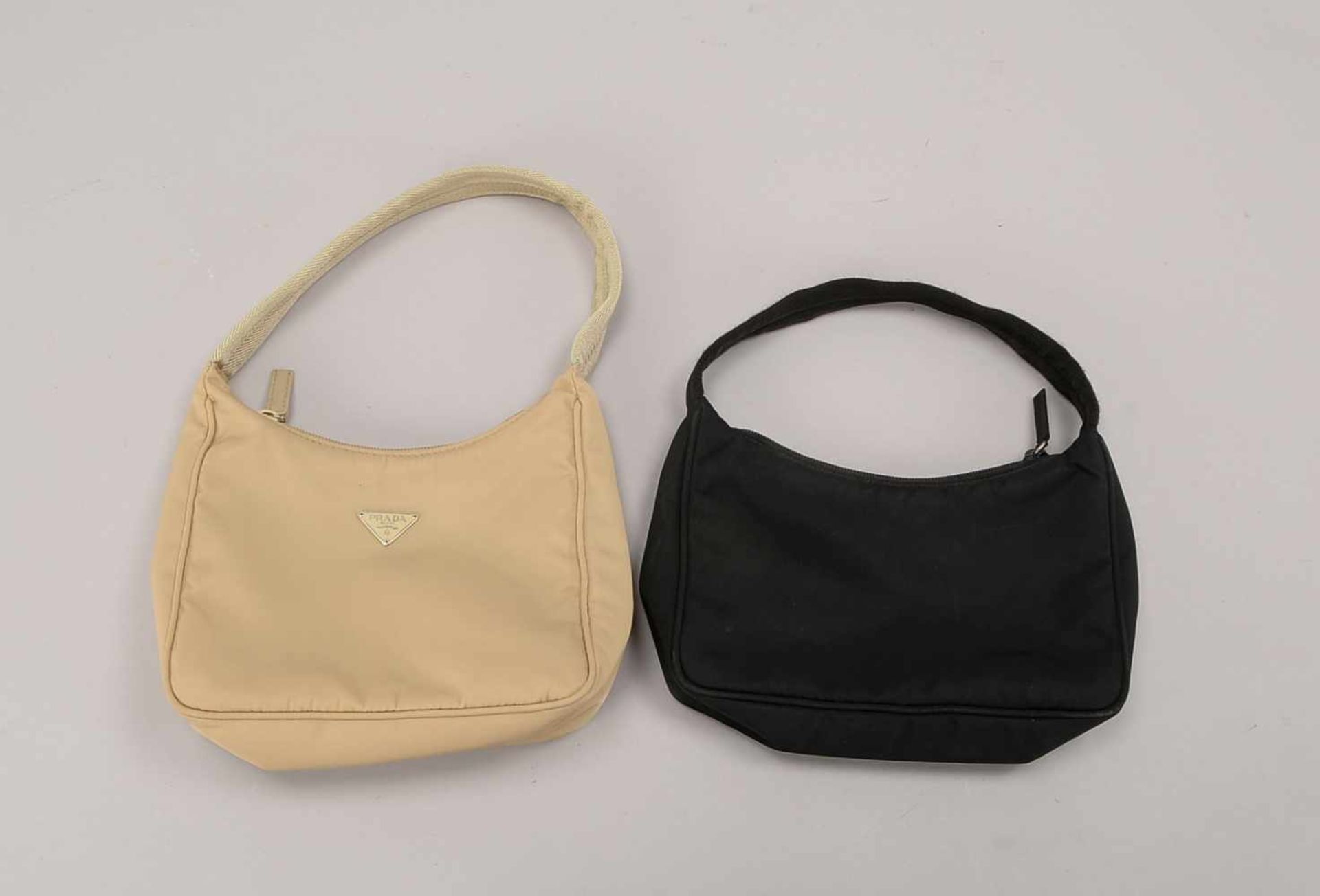 2 Damen-Handtaschen, Prada, Modell 'Tessuto Sport' in Schwarz und Beige, in gutem Zustand (jeweils