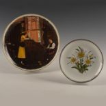 GROUP OF 2 DECORATIVE CERAMIC PLATES WHITE/YELLOW FLOWERS BY REUTTER & GORHAM; NORMAN ROCKWELL SCENE