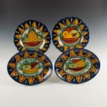 GROUP OF 4 HAND PAINTED COBALT AND OCHER STONEWARE PLATES