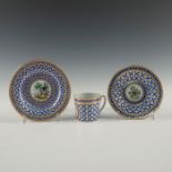 GILT AND ENAMELED PORCELAIN TEA TRIO