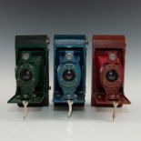 TRIO OF RAINBOW MULTICOLORED KODAK FOLDING CAMERAS