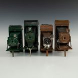 GROUP OF FOUR TAN AND GREEN FOLDING CAMERAS