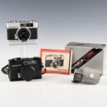 PAIR OF KONICA C35 (SILVER AND BLACK) CAMERAS