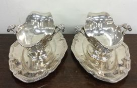 A pair of French silver sauce boats on stands with