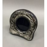 A modern silver stylish picture frame on bracket f