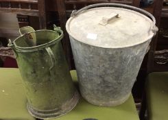 A large galvanized bucket together with one other.