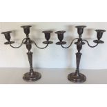 A pair of silver Adam style candelabra with fluted