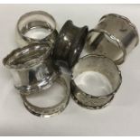 A bag containing various silver napkin rings. Appr