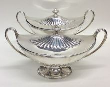 A rare pair of silver half fluted Adams' style turee