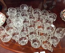 A good collection of cut glass glasses.