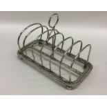 A large six division silver toast rack. London. By