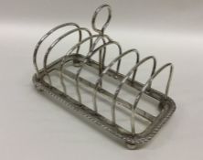 A large six division silver toast rack. London. By
