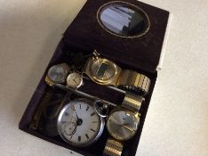 A silver pocket watch together with other watches.