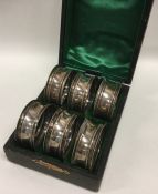 A boxed set of six plain silver napkin rings. Appr