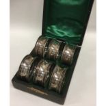 A boxed set of six plain silver napkin rings. Appr