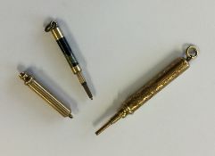 A gold mounted extending pencil together with two