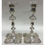 A good pair of cast Georgian style candlesticks wi