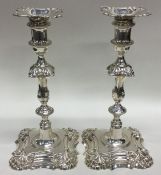 A good pair of cast Georgian style candlesticks wi