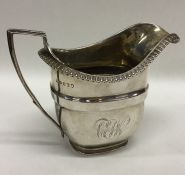 A Georgian silver cream jug with beaded rim. Londo