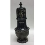 A large heavy silver sugar caster with pierced dec