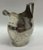 An Exeter silver helmet shaped cream jug with card