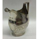 An Exeter silver helmet shaped cream jug with card