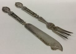 A pair of Continental silver eaters decorated with