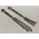 A pair of Continental silver eaters decorated with