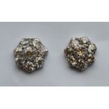 A pair of circular diamond cluster earrings in pla