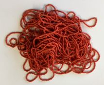 A graduated string of coral beads. Approx. 50 gram