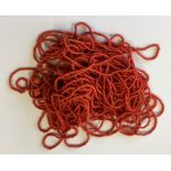 A graduated string of coral beads. Approx. 50 gram