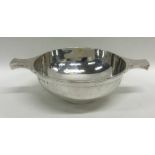 A heavy silver two handled quaich on pedestal